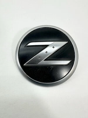 Nissan OEM 2003-2009 350Z 350 Z Front Fender Emblem Badge Logo Name 63890 CD000 - Image 1 of 4