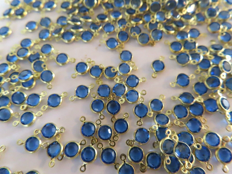 144 Swarovski Channel set 2 loop drops 19ss Sapphire color/Brass. - Image 1 of 1