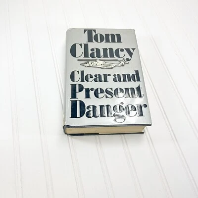 Tom Clancy / CLEAR AND PRESENT DANGER Inscribed Merry Christmas Signed 1989 - Image 1 of 4