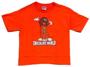 Reese’s 2009 Chocolate World Peanut Butter Cups T-Shirt KINDER Größe Medium orange - Bild 1 von 6