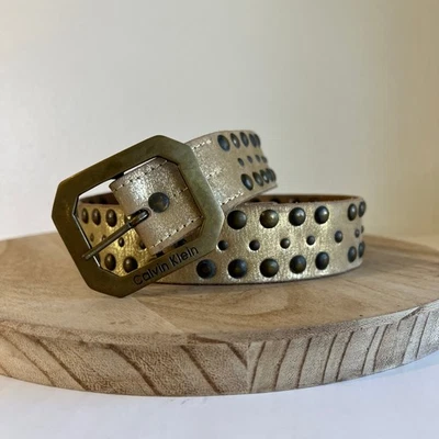 Пояс Calvin Klein золотистый металлик натуральная кожа с заклепками индийский размер средний - Изображение 1 из 4