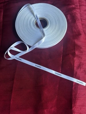 Embossed Authentic Chanel Ribbon White With Black Lettering. Approx 90m X 10mm - Image 1 of 3