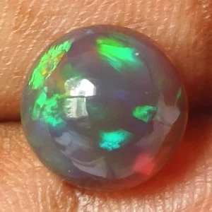 2.47CTS NATURAL FULLPLAY MIND BLOWING ETHIOPIAN BLACK OPAL ROUND 10MM - Picture 1 of 3