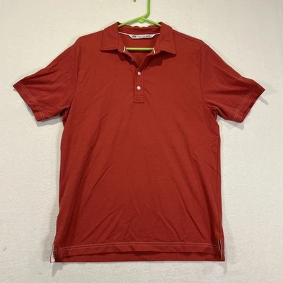 Camisa polo de golf Travis Matthews manga corta para hombre mediana rosa con logotipo informal Foto 1 de 4