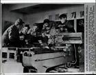 1959 Press Photo Students at machine crafts school inspect a shop tool in China