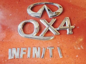 97 98 99 00 01 02 03 INFINITI QX4 TERRANO REGULUS REAR LID EMBLEM BADGE OEM - Picture 1 of 5