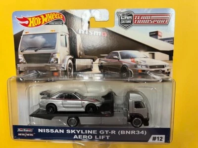 Hot Wheels Team Transport Nissan Skyline R34 GT-R Aero Lift #12 NISMO nuevo sellado Foto 1 de 4