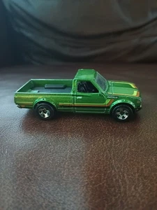 2013 HOT WHEELS DATSUN 620 GREEN 1:64 DIECAST 2 3/4" PICKUP TRUCK WITH STRIPES - Picture 1 of 7