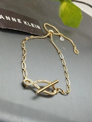 Brazalete Deslizante Infinito Cristal Transparente Tono Dorado Anne Klein $32 Nuevo Foto 1 de 4