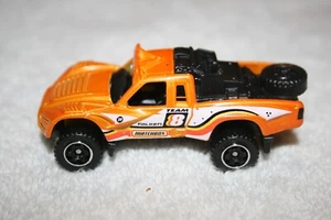 NEU Matchbox 2022 MBX Rally II 2009 Baja Bullet Pickup Truck orange 1:64 lose - Bild 1 von 7