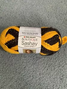 Red Heart Boutique Sashay Garn gold/schwarz 1 Knäuel - Bild 1 von 6
