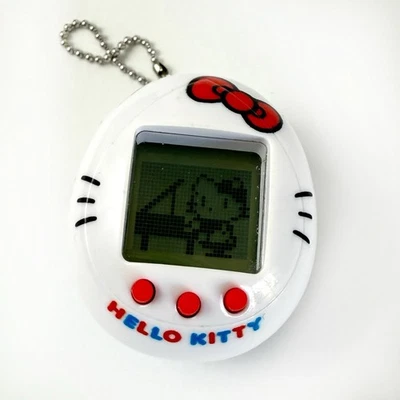 HELLO KITTY Bandai 2020 Sanrio Tamagotchi mascota virtual con baterías nuevas Foto 1 de 4