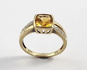 9CT. YELLOW GOLD RING SET WITH ONE CUSHION SHAPED CITRINE AND 6 SMALL DIAMONDS - Picture 1 of 6