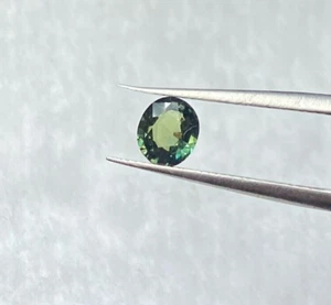 0.80 CTS NATURAL UNTREATED SAPPHIRE, OVAL CUT 5.8 X 5 X 2.9 MM, NICE GREEN COLOR - Picture 1 of 3
