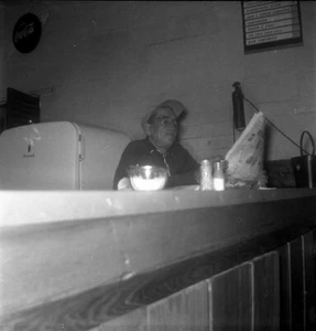 Vintage Photo Negative OLDER MAN CASUALLY READS PAPER AT LOCAL DINER FL 1955 - Picture 1 of 1