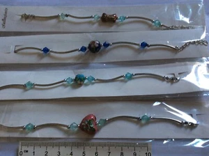 LOTTO COMPOSTO DA 4 BRACCIALETTI (chiusi e confezionati) - Picture 1 of 1