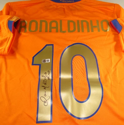 Ronaldinho / Autographed F.C. Barcelona Nike Dri-Fit Orange Soccer Jersey / BAS - Image 1 of 4