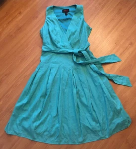 Sommerkleid grün ärmellos mit Bindeband voller Rock V-Ausschnitt Wickeloptik Größe 4 gebraucht - Bild 1 von 11