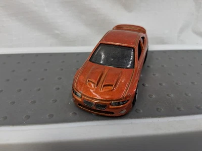 Hot Wheels 2021 First Edition 2006 Pontiac GTO  Bronze Die Cast - Image 1 of 4