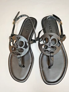 NUEVAS Sandalias Planas Coach Para Mujer 7.5B Cuero Negro "Jaci" Logo Correa en T Cordones - Imagen 1 de 8