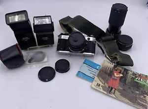 Fotocamera reflex 35 mm Canon AE-1 Program vintage con 2 obiettivi 2 flash manuale extra - Foto 1 di 22