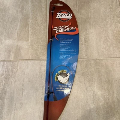 Zebco Dock Demon Spinning Reel Fishing Rod Combo 30-inch 1-Piece Pre-Spooled Red - Image 1 of 4