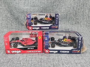 Lot Of 3 Burago Diecast Formula 1 -1/43 Scale 2 RB19 and 1 SF23 - NIB see notes - Picture 1 of 19