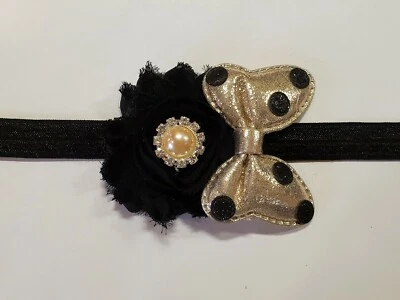 Cute!! Golden and black Minnie Mouse Baby Girl Elastic Headband Flower Hair Bow. - Image 1 of 2