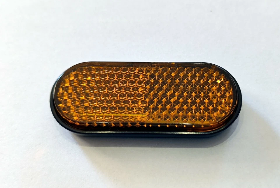 Mini Seiten Reflektor Rückstrahler orange Katzenauge selbstklebend KFZ oval - Bild 1 von 2