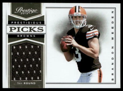 2012 Panini Prestige #8 Brandon Weeden Prestigious Picks Materials #/299 - Image 1 of 2