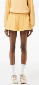 Lacoste Ladies Natural Dyed Fleece Shorts in Yellow.     C47 - Picture 1 of 13