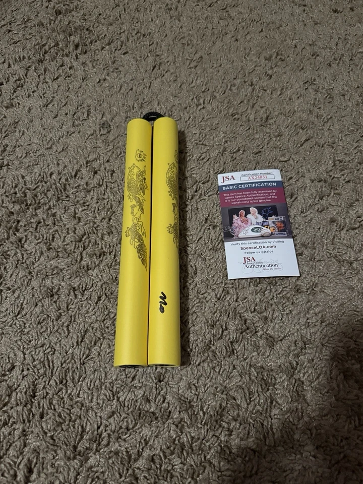 Nick Diaz Signed Nunchucks - Image 1 of 1