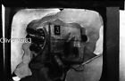 Vintage odd abstract photo negative - old TV camera on working TV screen