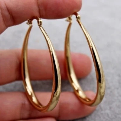 Pendientes de aro brillantes colgantes ovulares de oro de 14k para mujer Foto 1 de 4