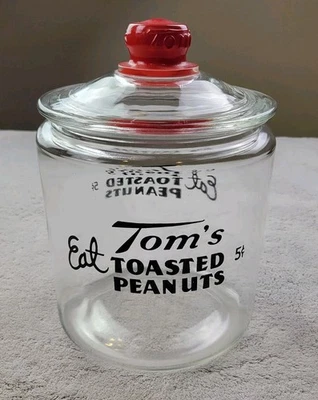 Vintage Counter Top Eat Tom's Toasted Peanuts Glass Jar 5 Cents Embossed Red Lid - Image 1 of 4