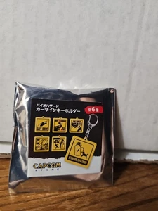 Capcom Resident Evil Biohazard Autoschild Schlüsselanhänger Achtung Tofu Crash Store L/E - Bild 1 von 6