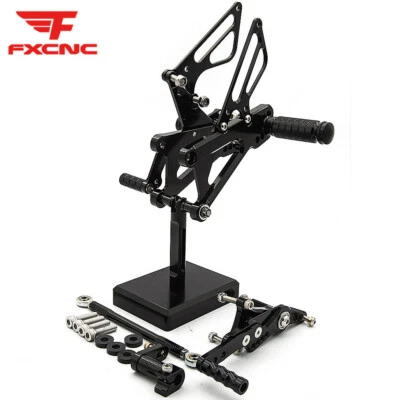 Juego trasero reposapiés estriberas pedales GP para Triumph DAYTONA 675R 2013-2017 Foto 1 de 4