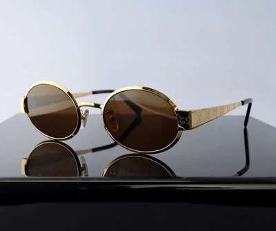 Óculos de sol Gucci G1854S 005 dourado com logotipo GG/lente marrom oval 100% UV - Imagem 1 de 4