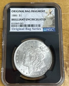 Dólar de plata Morgan de $1 de 1886 - Serie fragmento de bolsa original NGC BU. - Imagen 1 de 7