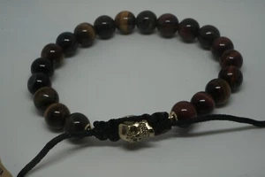 Ein handgefertigtes Tigerauge Armband mit einem original Messing Micro-Totenkopf auf einem verstellbaren - Bild 1 von 4