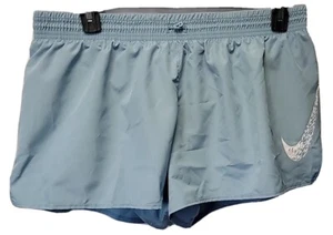 NUEVOS CON ETIQUETAS PANTALONES CORTOS PARA CORRER NIKE para mujer talla XL verde espuma marina con pantizas dentro $35.00 - Imagen 1 de 3