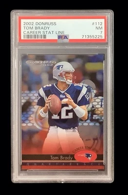 2002 donruss #112 tom brady; career stat line 82/265 insert PSA 7  (POP 3, SP) - Image 1 of 3