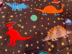 Dinosaurs in Space Scrap 9"x 21” Flannel Cotton Fabric, Fat Eighth, stars planet - Picture 1 of 2