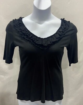 Blusa Express mujer talla M negra con ribete de volantes. Foto 1 de 4
