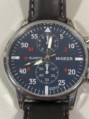 Reloj para Hombres Migeer Esfera Azul Tono Plateado Estuche Redondo Banda Negra 8 Pulgadas Foto 1 de 4