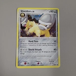 Tarjeta de juego de cartas coleccionables Shieldon LV.26 SWIRL DP08 Black Star Promo Cosmos Holo Pokemon 2007 MP - Imagen 1 de 5