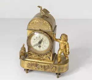 Pendulette Empire bronze doré 'A CYTHERE' ange chien fleur XIXème - Bild 1 von 1