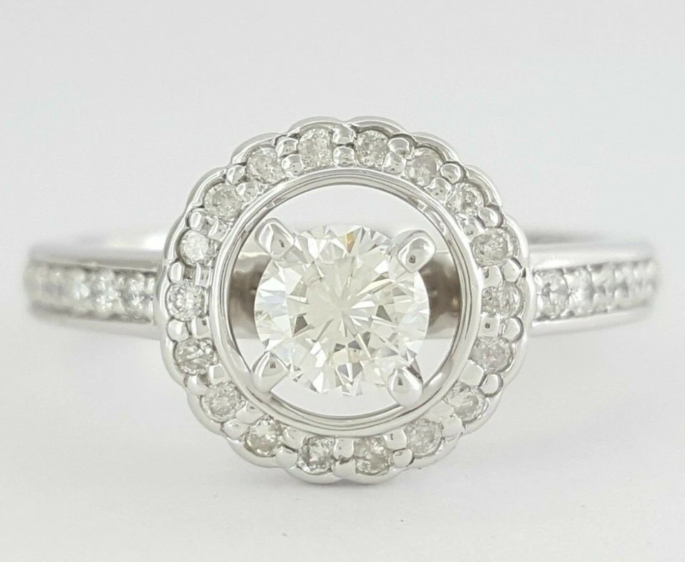 Anillo de compromiso redondo con halo de diamantes talla brillante de oro de 14 quilates de 0,73 quilates Foto 1 de 4