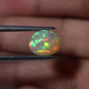 11x9 mm Natürlicher Rot Grün Regenbogen Feuer Äthiopischer Opal Oval Cabochon Edelstein - Bild 1 von 12