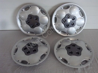 Juego de 4 cubiertas de rueda plateadas de 14" de neón Dodge and Plymouth 1995-1996 nuevas de fábrica Foto 1 de 4